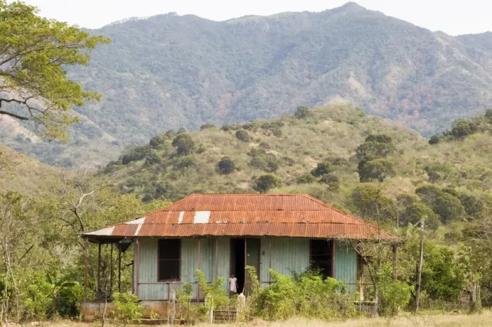 Framed Print : A typical tin roofed house in the mountains near Santiago de Cuba, Cuba Framed Print : A typical tin roofed house in the mountains near Santiago de Cuba, Cuba