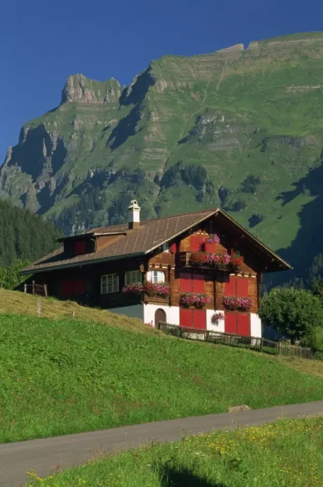 Framed Print : Typical wooden chalet with colourful shutters Framed Print : Typical wooden chalet with colourful shutters