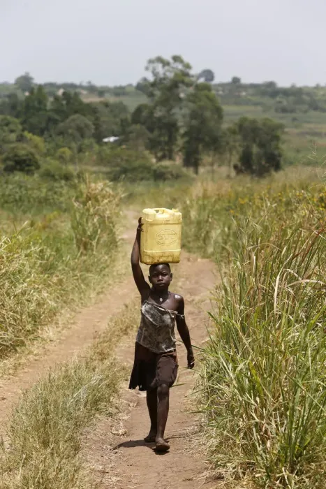 Framed Print : Ugandan child fetching water, Masindi, Uganda, Africa Framed Print : Ugandan child fetching water, Masindi, Uganda, Africa