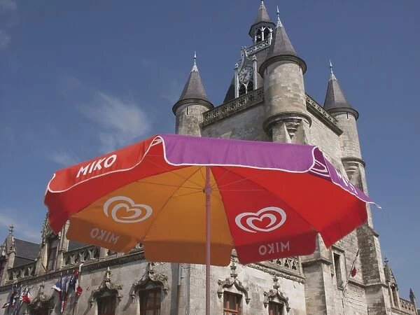 Umbrella advertising ice cream, with Gothic town hall behind, Rue, Somme