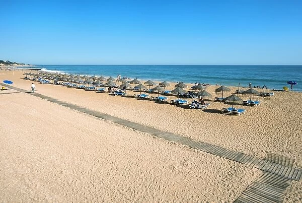 Umbrellas and beach chairs, Fishermans Beach (Praia dos Barcos), Albufeira, Algarve, Portugal, Europe