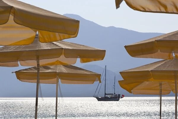 Umbrellas and yacht, Psili Ammos, Samos, Aegean Islands, Greece