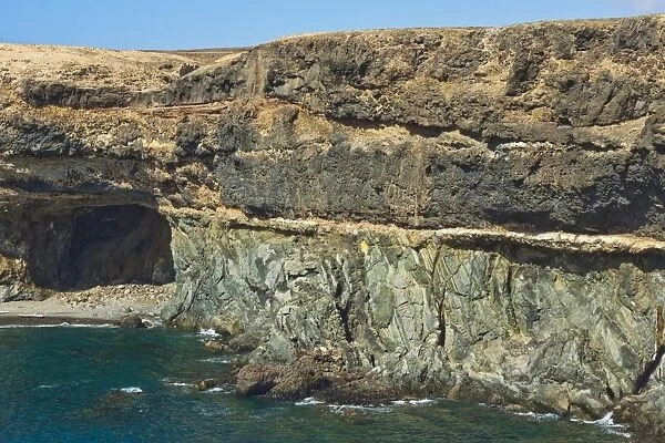 Unconformity of older Jurassic sediments and Pliocene limestone plus later lava on top at Caleta Negra, Ajuy, Fuerteventura, Spain, Atlantic, Europe