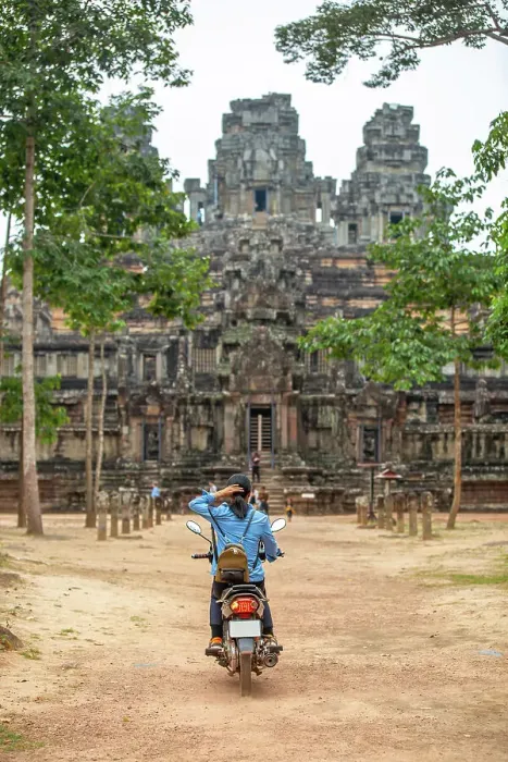 Framed Print : A unidentifed woman riding a scooter towards Banteay Kdei temple in Angkor complex, UNESCO World Heritage Site, Cambodia, Indochina, Southeast Asia, Asia