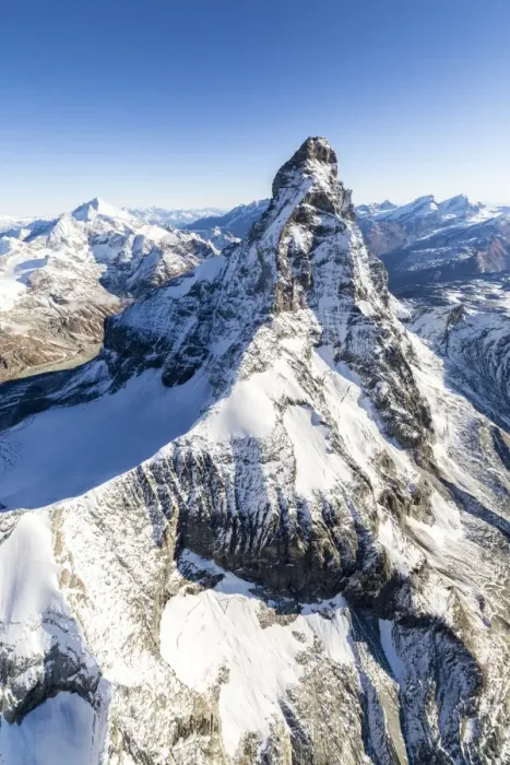 Framed Print : The unique shape of the Matterhorn sorrounded by its mountain range covered in snow, Swiss Canton of Valais, Swiss Alps, Switzerland, Europe Framed Print : The unique shape of the Matterhorn sorrounded by its mountain range covered in snow, Swiss Canton of Valais, Swiss Alps, Switzerland, Europe