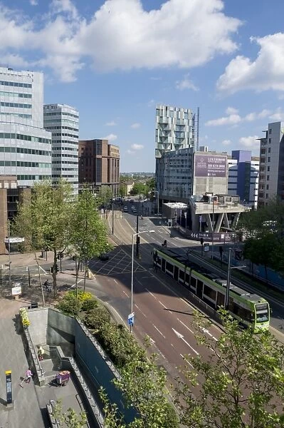 Urban street scene on A212 with tram passing through Croydon, Greater London, England, United Kingdom, Europe