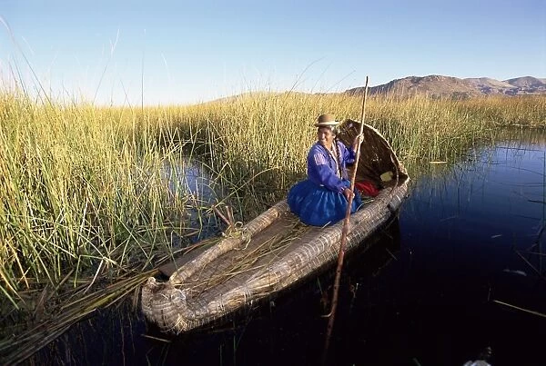 A Uros Indian woman in a traditional reed boat