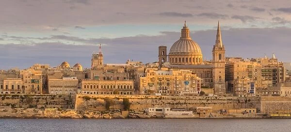 Valletta skyline panorama at sunset with the Carmelite Church dome and St. Pauls Anglican Cathedral, Valletta, Malta, Mediterranean, Europe