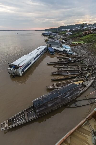 Various boats along the banks of the Amazon River, Loreto, Peru, South America