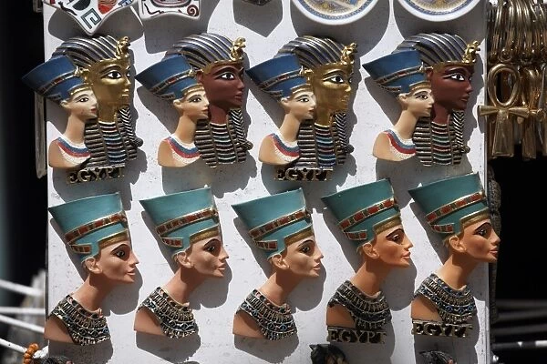 Various Egyptian badges depicting pharaohs, on sale at Aswan Souq, Aswan