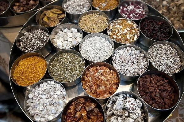 Various types of sonf, mouth freshener, in aluminium pots, some coated in silver, in sonf stall in market, Kolkata, West Bengal, India, Asia