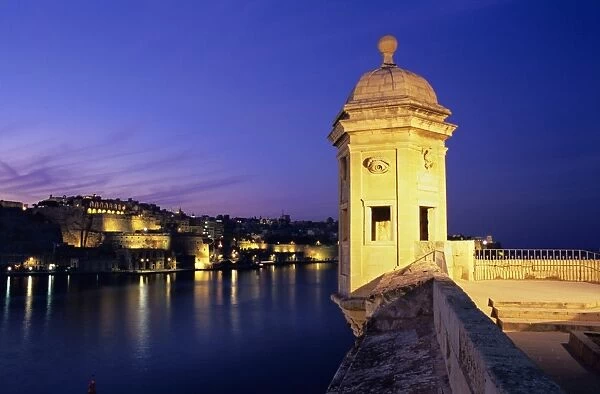 Vedette watchtower and view across the Grand Harbour to Valletta at dusk