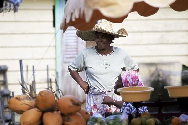 Vendor at local vegetable market, Fort de France, Martinique, Lesser Antilles