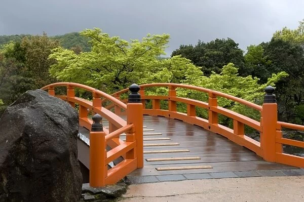 Vermilion-colored arched bridge at Murasaki Shikibu Park in Takefu City, Fukui, Japan