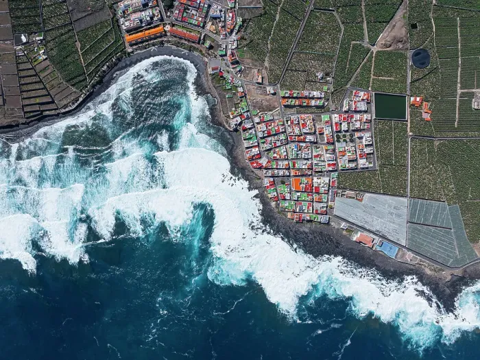 Framed Print : Vertical aerial view from the drone of a little coastal village with colorful roofs, Tenerife, Canary Islands, Spain, Atlantic, Europe Framed Print : Vertical aerial view from the drone of a little coastal village with colorful roofs, Tenerife, Canary Islands, Spain, Atlantic, Europe