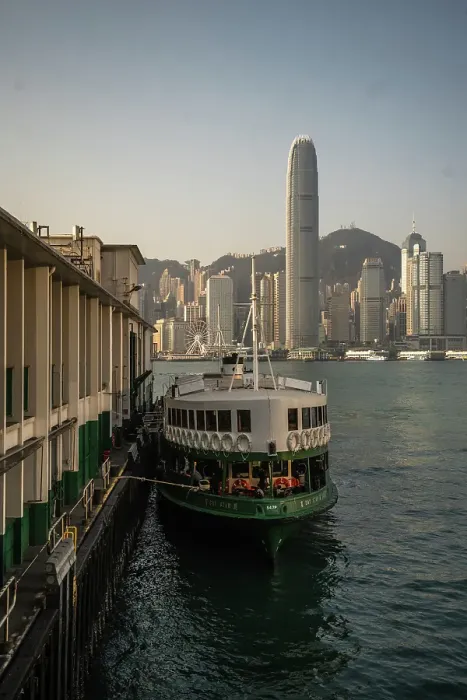 Framed Print : A vertical image of a docked Star ferry with Hong Kong Skyline in the background, Hong Kong, China Framed Print : A vertical image of a docked Star ferry with Hong Kong Skyline in the background, Hong Kong, China