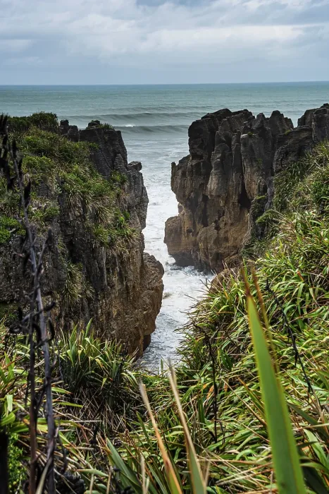 Framed Print : Vertical View of Towering Limestone Cliffs and Deep Ocean Channel at Punakaiki, West Coast, New Zealand Framed Print : Vertical View of Towering Limestone Cliffs and Deep Ocean Channel at Punakaiki, West Coast, New Zealand