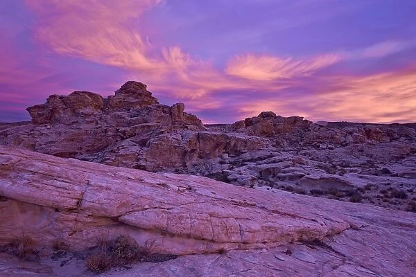 Vibrant orange clouds over red and white sandstone at sunset, Gold Butte, Nevada, United States of America, North America