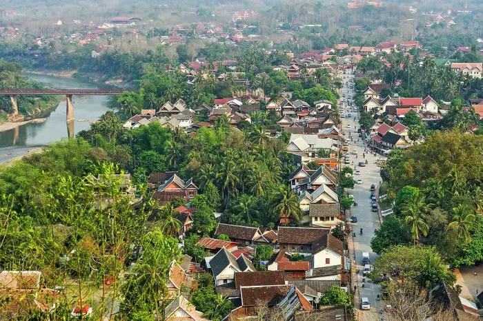 Framed Print : Vieiw over Luang Prabang to the Southeast from Phu Si hill with the Nam Khan River and the Old Bridge in the background, Luang Prabang, Laos Framed Print : Vieiw over Luang Prabang to the Southeast from Phu Si hill with the Nam Khan River and the Old Bridge in the background, Luang Prabang, Laos
