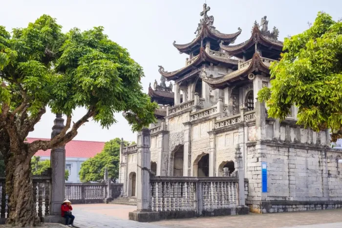 Framed Print : Vietnamese woman in front of Phat Diem Cathedral, Phat Diem, Ninh Binh Province, Vietnam Framed Print : Vietnamese woman in front of Phat Diem Cathedral, Phat Diem, Ninh Binh Province, Vietnam