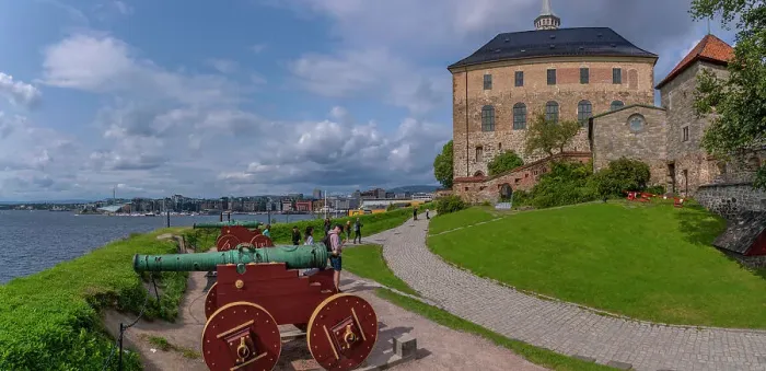 Framed Print : View of the Akershus Fortress, cannons and city skyline from inside the walls on a sunny day, Oslo, Norway, Scandinavia, Europe Framed Print : View of the Akershus Fortress, cannons and city skyline from inside the walls on a sunny day, Oslo, Norway, Scandinavia, Europe