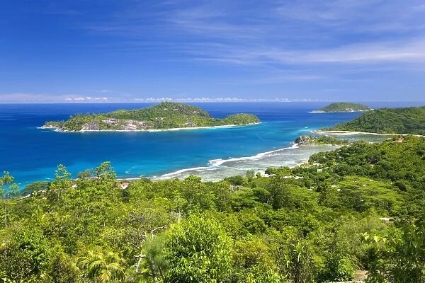 View across Anse l Islette to the offshore islands of Therese and Conception from hillside above Port Glaud, Port Glaud district, Island of Mahe, Seychelles, Indian