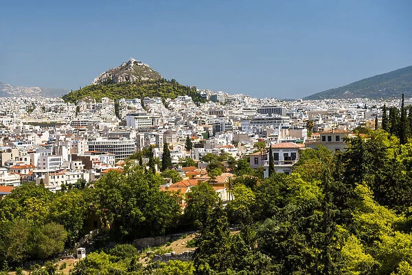 View of Athens and Likavitos Hill over the rooftops of the Plaka District from The Acropolis