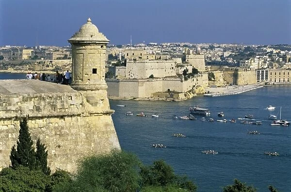 View over Bastions and Grand Harbour to Fort St. Angelo with Rowing Regatta