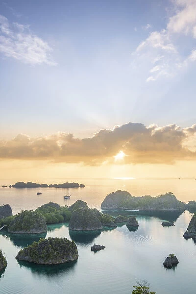 View over a bay of islands at dawn from the Piaynemo lookout, Raja Ampat, West Papua