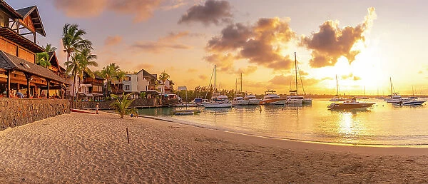 View of beach and boats in Grand Bay at golden hour, Mauritius, Indian Ocean, Africa