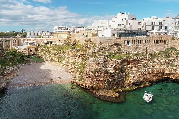 View of beach and old town on limestone cliffs, Polignano a Mare, Puglia, Italy, Europe