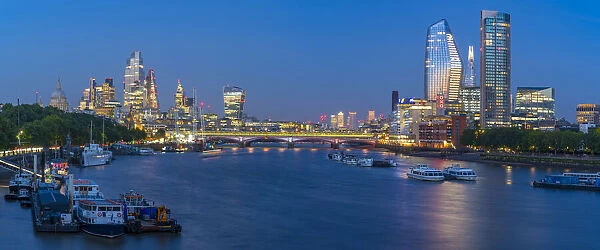 View of Blackfriars Bridge, River Thames and The City of London skyline at dusk, London