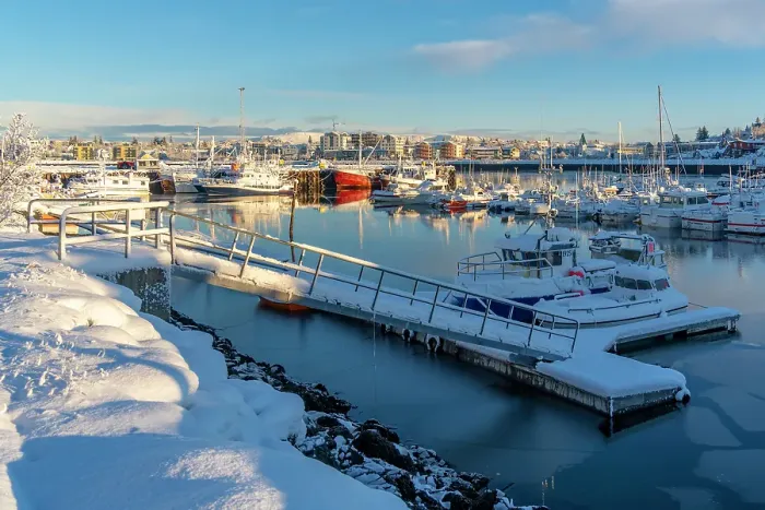 Framed Print : View of boats in Hafnarfjorour Marina and town in background in winter, Hafnarfjorour, Iceland Framed Print : View of boats in Hafnarfjorour Marina and town in background in winter, Hafnarfjorour, Iceland