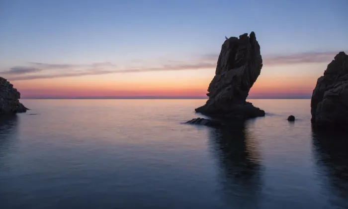 Framed Print : View from Calura Bay across the Tyrrhenian Sea, dawn, rock stack silhouetted against Framed Print : View from Calura Bay across the Tyrrhenian Sea, dawn, rock stack silhouetted against