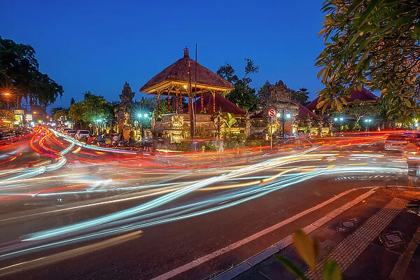 View of car trail lights and Ubud Palace at dusk, Ubud, Kabupaten Gianyar, Bali, Indonesia, South East Asia, Asia