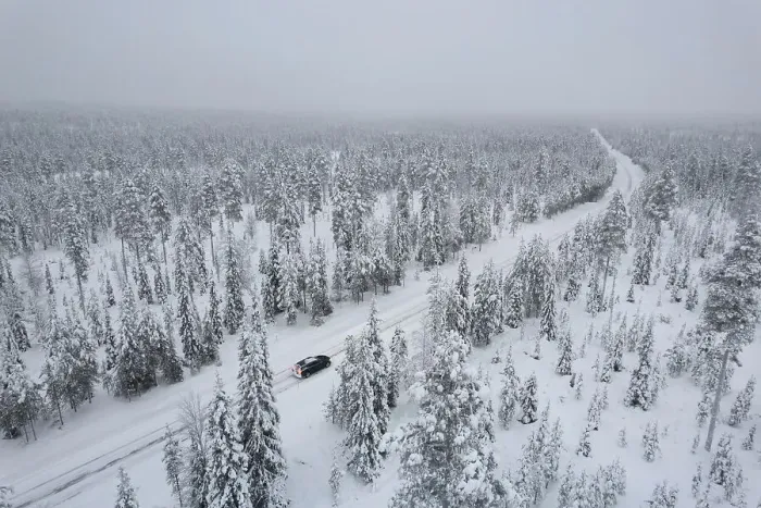 Framed Print : View from above of a car travelling icy road in the middle of the frozen forest covered with snow, Akaslompolo, Kolari, Pallas-Yllastunturi National Park, Lapland region, Finland, Europe