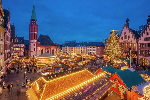 View of carousel and Christmas Market stalls at dusk, Roemerberg Square, Frankfurt am Main, Hesse, Germany, Europe