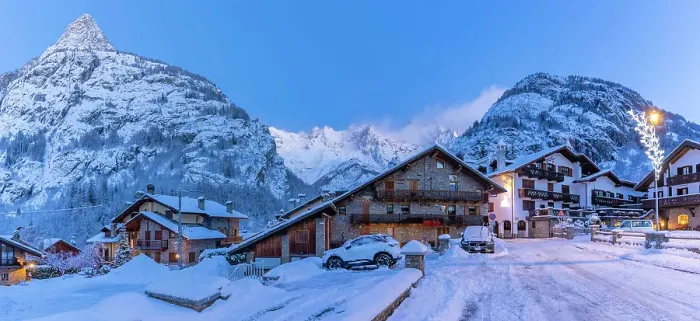 Framed Print : View of chalets and snow covered mountains in Courmayeur before dawn in winter, Courmayeur, Aosta Valley, Italian Alps, Italy