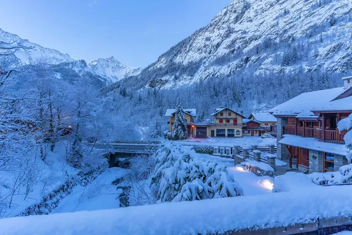 Framed Print : View of chalets and snow covered mountains in Courmayeur before dawn in winter, Courmayeur, Aosta Valley, Italian Alps, Italy