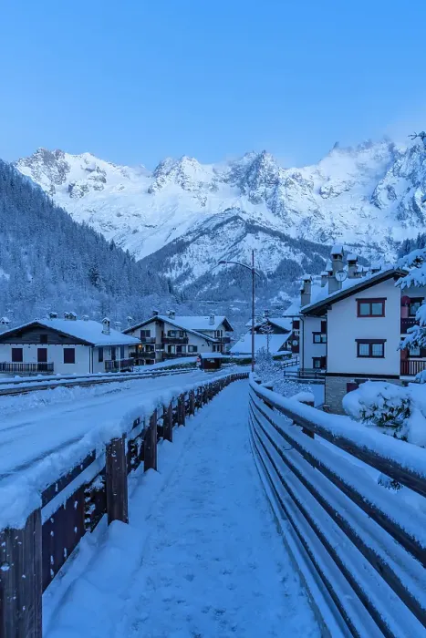 Framed Print : View of chalets and snow covered mountains in Courmayeur before dawn in winter, Courmayeur, Aosta Valley, Italian Alps, Italy
