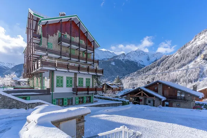 Framed Print : View of chalets and snow covered mountains in Courmayeur at sunrise in winter, Courmayeur, Aosta Valley, Italian Alps, Italy Framed Print : View of chalets and snow covered mountains in Courmayeur at sunrise in winter, Courmayeur, Aosta Valley, Italian Alps, Italy