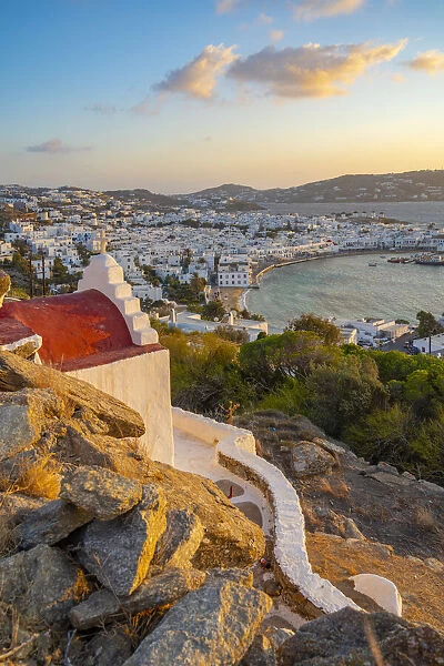 View of chapel and town from elevated view point at sunset, Mykonos Town, Mykonos