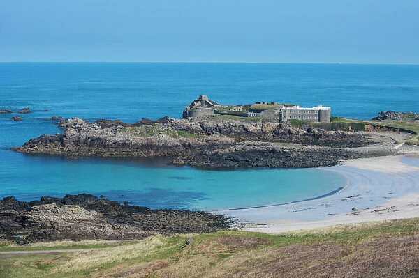 View over Chateau A L Etoc (Chateau Le Toc) and Saye Beach, Alderney, Channel Islands