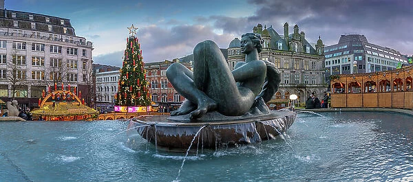 View of Christmas Market stalls and The River fountain (The Floozie in the Jacuzzi), Victoria Square, Birmingham, West Midlands, England, United Kingdom, Europe