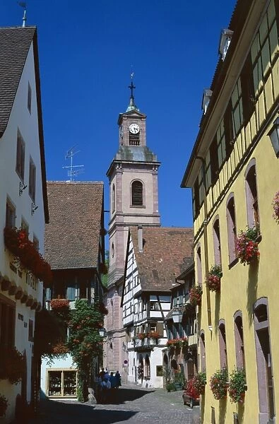 View to church tower and timbered houses, Riquewihr, Haute-Rhin, Alsace, France, Europe