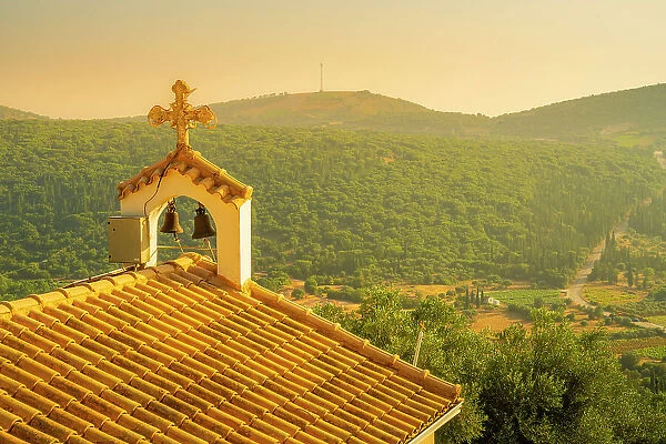 View of church, woodland and vineyards near Poulata, Kefalonia, Ionian Islands, Greek Islands, Greece, Europe