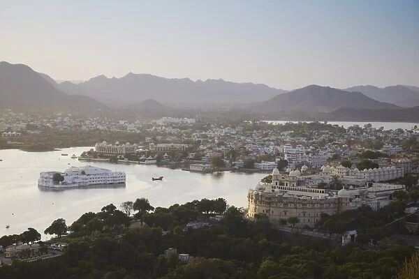 View of City Palace and Lake Palace Hotel, Udaipur, Rajasthan, India, Asia