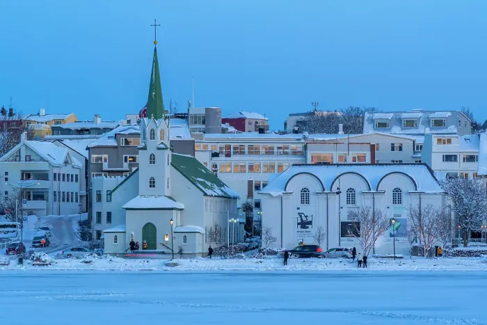 Framed Print : View of the city skyline of Reykjavik from Tjornin lake at sunset in winter, Reykjavik, Iceland