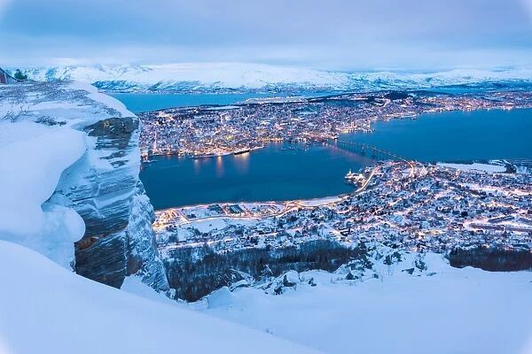 View of the city of Tromso at dusk from the mountain top reached by the Fjellheisen cable car