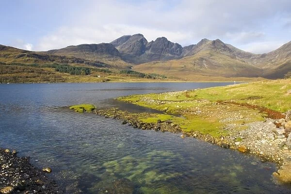 View across the clear waters of Loch Slapin to the Cuillin Hills, the peak of Bla Bheinn